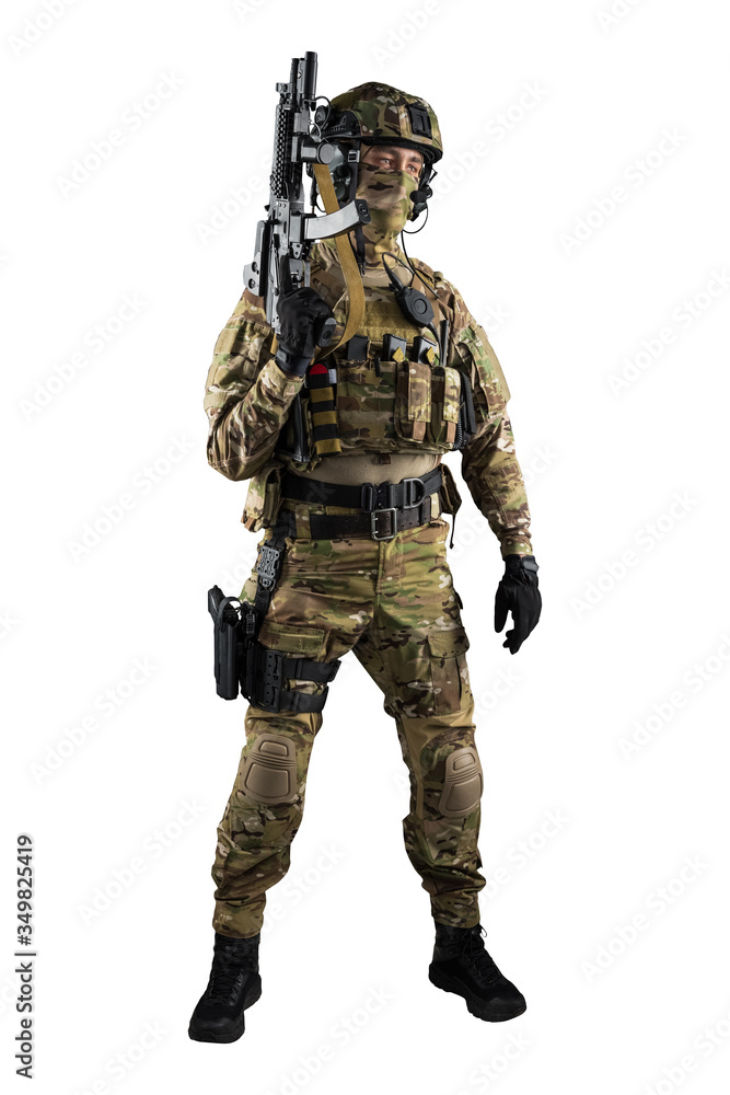 Soldier holding assault rifle. Uniform conforms to special services of the Russian Federation. Shot in studio. Isolated with clipping path on white background