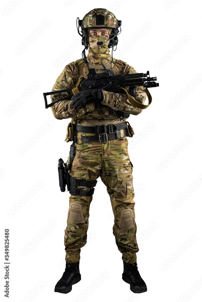 Soldier holding assault rifle. Uniform conforms to special services of the Russian Federation. Shot in studio. Isolated with clipping path on white background Soldier holding assault rifle. Uniform conforms to special services of the Russian Federation. Shot in studio. Isolated with clipping path on white background