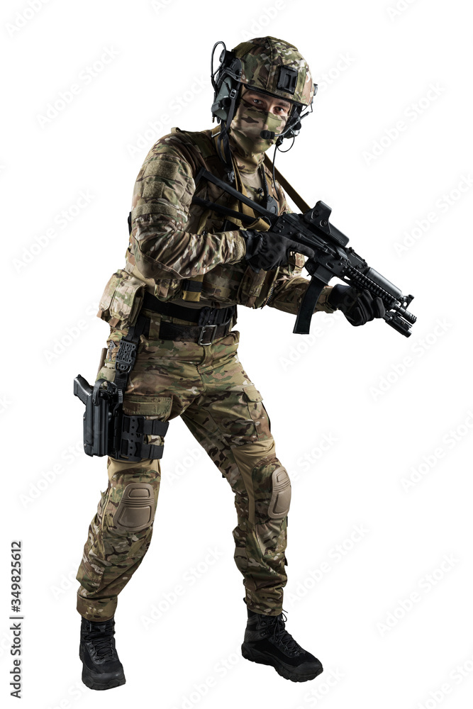 Soldier holding assault rifle. Uniform conforms to special services of the Russian Federation. Shot in studio. Isolated with clipping path on white background