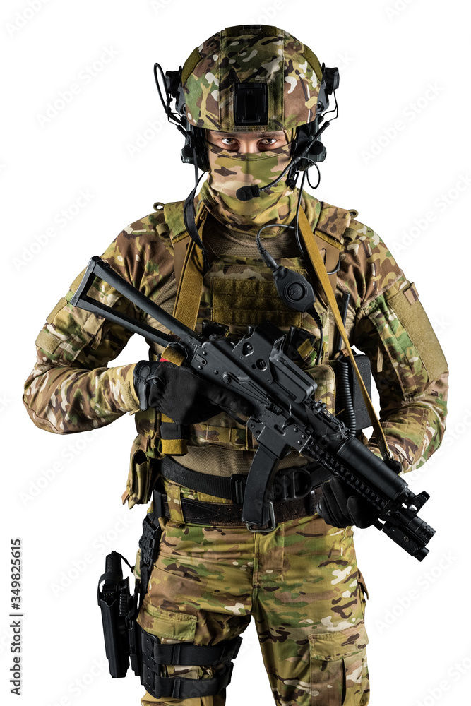 Soldier holding assault rifle. Uniform conforms to special services of the Russian Federation. Shot in studio. Isolated with clipping path on white background Soldier holding assault rifle. Uniform conforms to special services of the Russian Federation. Shot in studio. Isolated with clipping path on white background