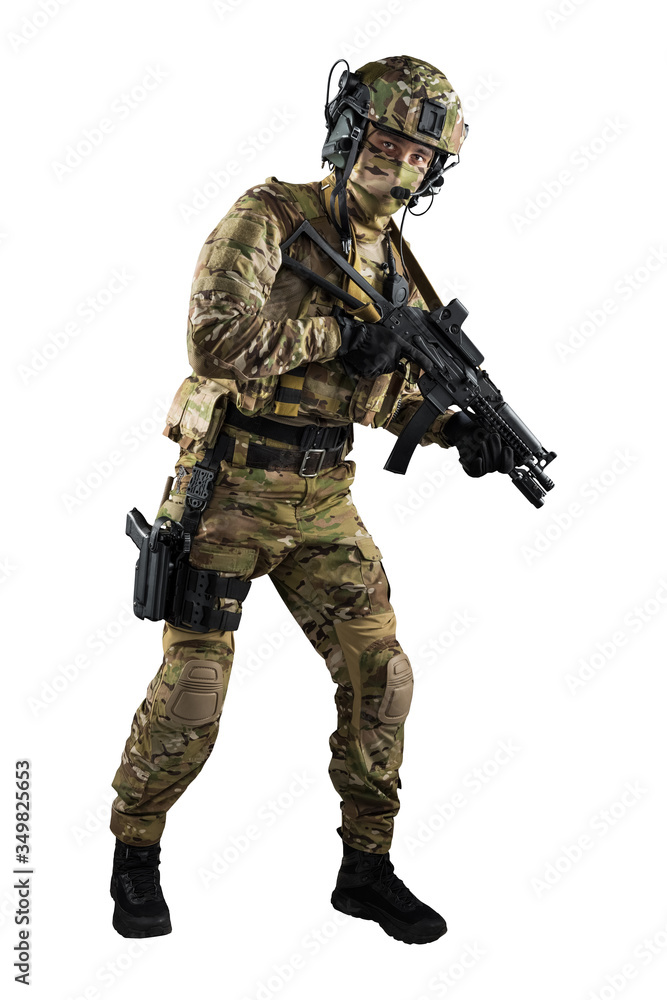 Soldier holding assault rifle. Uniform conforms to special services of the Russian Federation. Shot in studio. Isolated with clipping path on white background Soldier holding assault rifle. Uniform conforms to special services of the Russian Federation. Shot in studio. Isolated with clipping path on white background