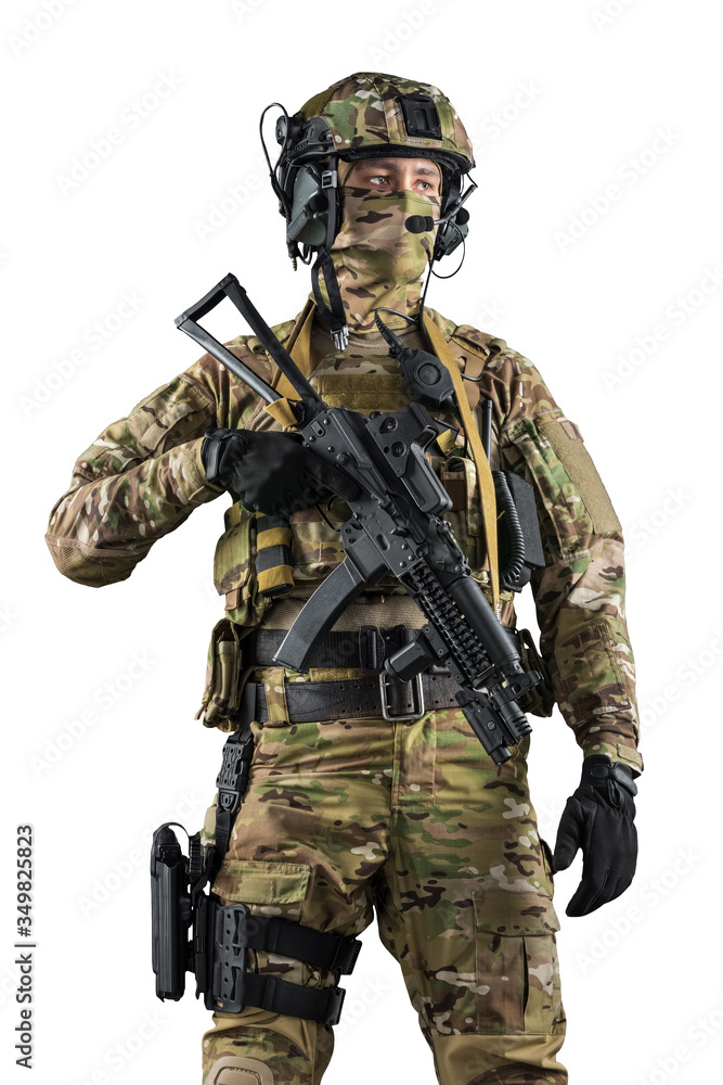 Soldier holding assault rifle. Uniform conforms to special services of the Russian Federation. Shot in studio. Isolated with clipping path on white background Soldier holding assault rifle. Uniform conforms to special services of the Russian Federation. Shot in studio. Isolated with clipping path on white background