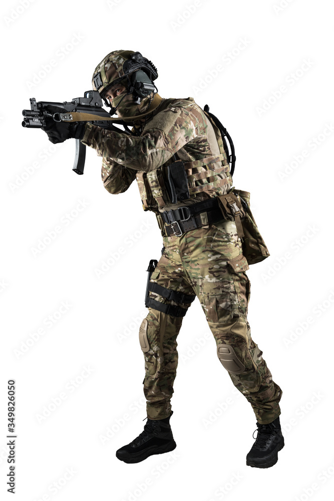 Soldier holding assault rifle. Uniform conforms to special services of the Russian Federation. Shot in studio. Isolated with clipping path on white background Soldier holding assault rifle. Uniform conforms to special services of the Russian Federation. Shot in studio. Isolated with clipping path on white background
