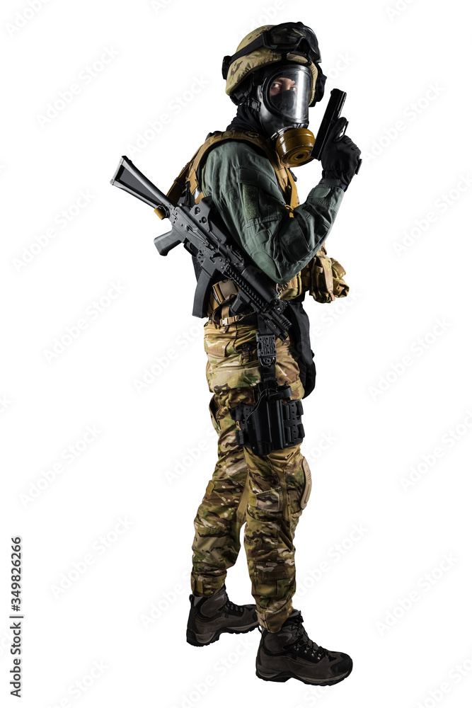 Soldier holding assault rifle. Uniform conforms to special services of the Russian Federation. Shot in studio. Isolated with clipping path on white background