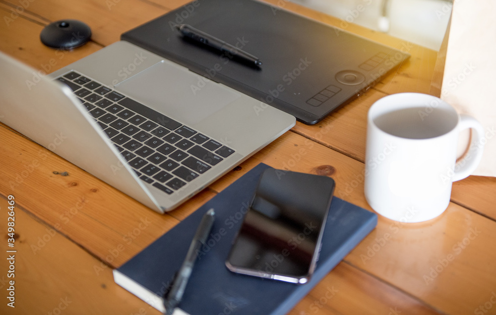 Work at home, laptop accessories, digital writing pen, mobile phone, work data notepad. Work at home, laptop accessories, digital writing pen, mobile phone, work data notepad.