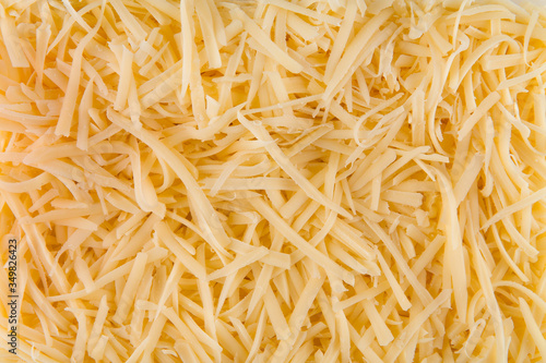 Closeup background texture grated cheese 