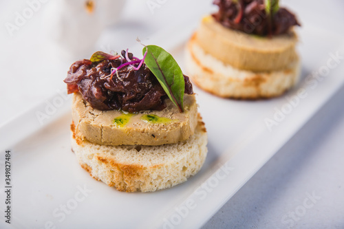 Homemade duck liver pate with bruschetta, greens and red onion jam