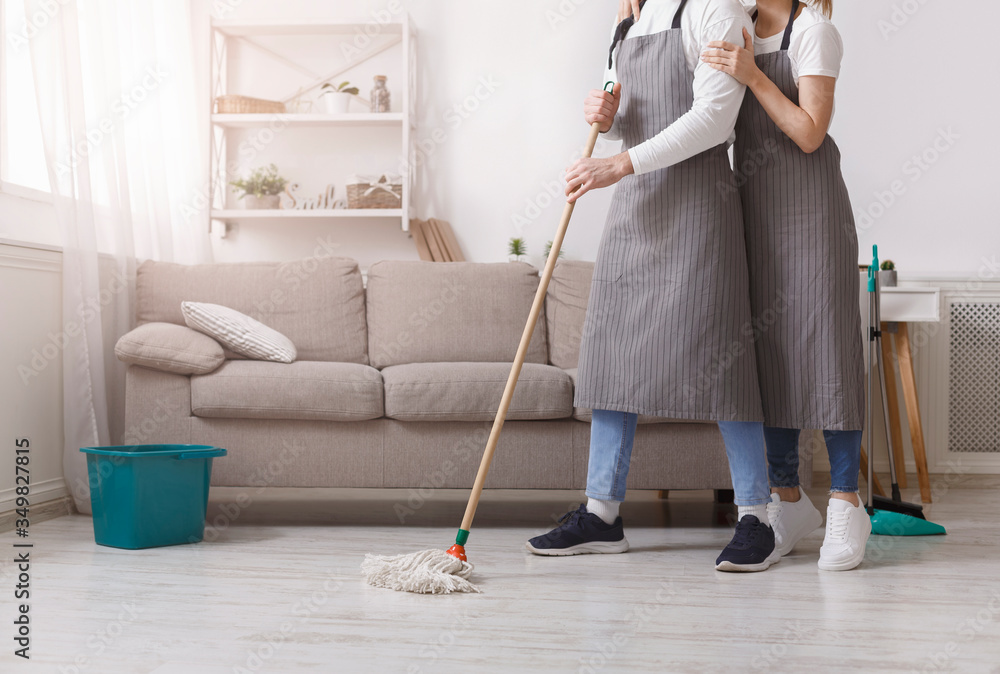 Sharing Household Duties. Unrecognizable Couple Cleaning Floor Together, Tidying Flat Sharing Household Duties. Unrecognizable Couple Cleaning Floor Together, Tidying Flat