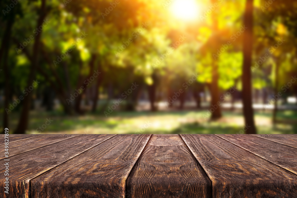 Wooden desk on bokeh blur abstract natural background Wooden desk on bokeh blur abstract natural background