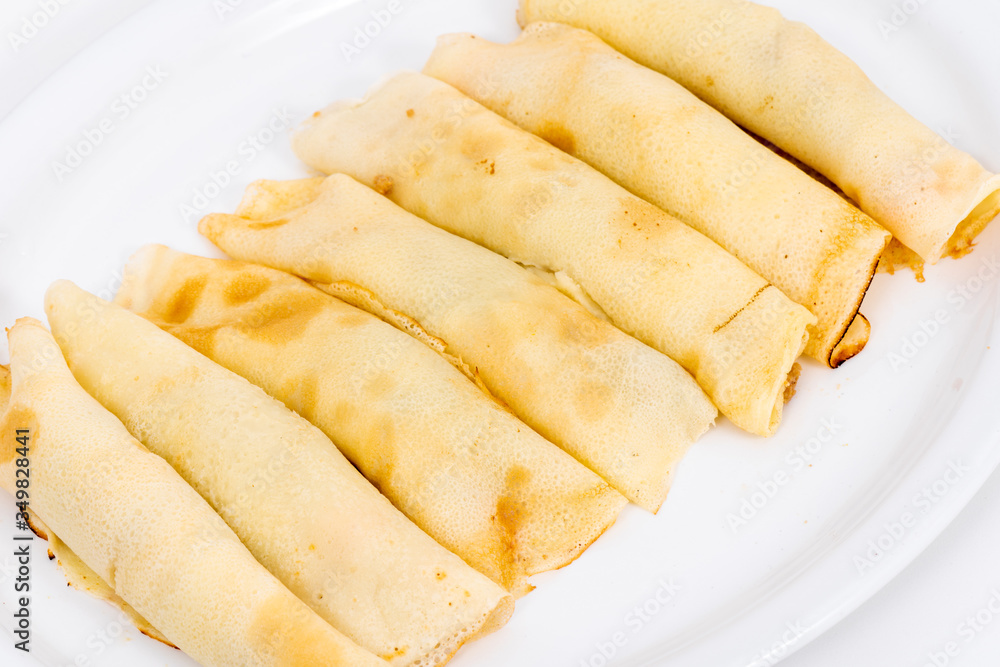 Delicious pancakes rolls filled with meat and cheese. Delicious pancakes rolls filled with meat and cheese.