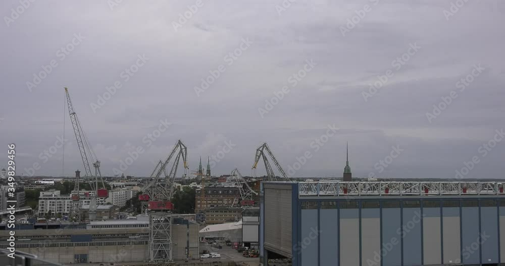 4K Helsinki Baltic Sea Finnish Bay lagoon, buildings and port construction cranes cloudy summer day video in Jatkasaari district in Finland capital, northern Europe 4K Helsinki Baltic Sea Finnish Bay lagoon, buildings and port construction cranes cloudy summer day video in Jatkasaari district in Finland capital, northern Europe