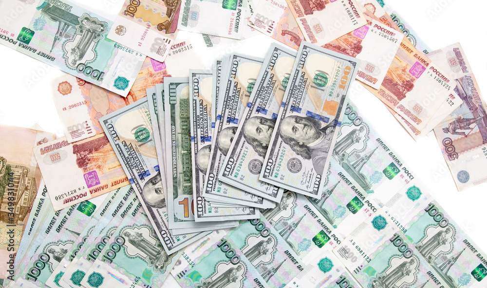 Dollars and Russian rubles on the table as background Dollars and Russian rubles on the table as background