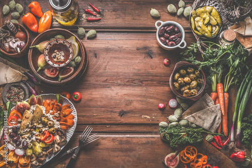 Wallpaper Mural Healthy vegan or vegetarian food background with snacks. Various fresh, pickled and fermented vegetables in bowls. Hummus plate with roasted vegetables and nuts. Olives, figs, green almond , chickpeas Torontodigital.ca