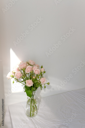 Flowers in a glass vase on the table