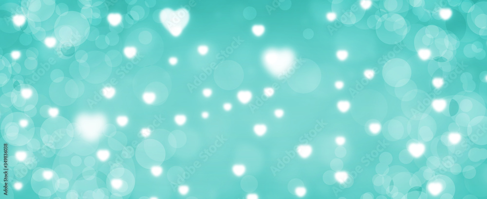 Glowing green bokeh background. Spring concept. Blurred bokeh circles and hearth shapes. Website banner. Celebration. Christmas. Glowing green bokeh background. Spring concept. Blurred bokeh circles and hearth shapes. Website banner. Celebration. Christmas.