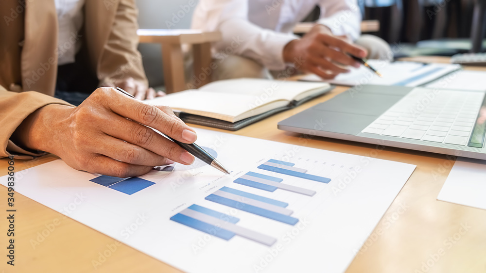 Business team brainstorming and discussing with financial data and report graph. Teamwork meeting working concept. Business team brainstorming and discussing with financial data and report graph. Teamwork meeting working concept.