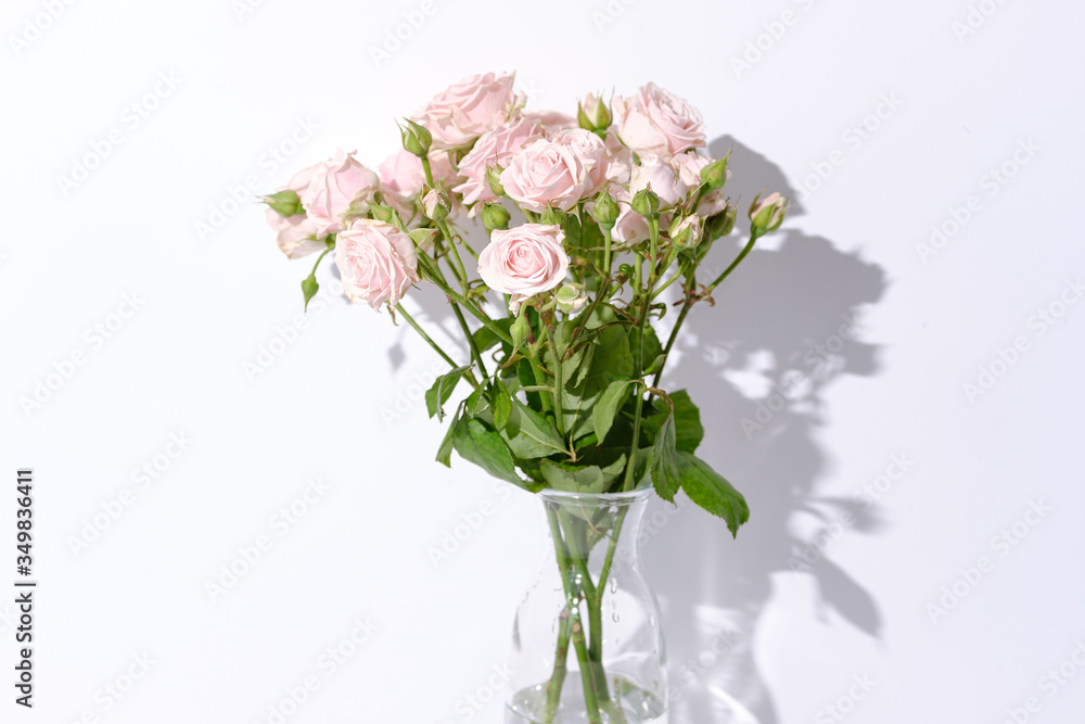 Flowers in a glass vase on the table