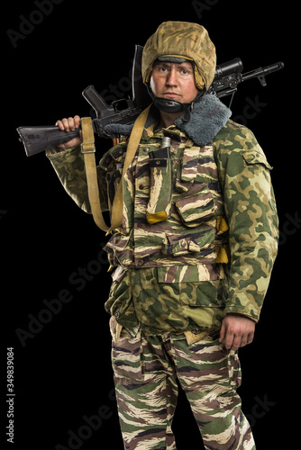 Male in uniform conforms to Russian army special forces (OMON) in War in Chechnya. Isolated on black backgroundx photo