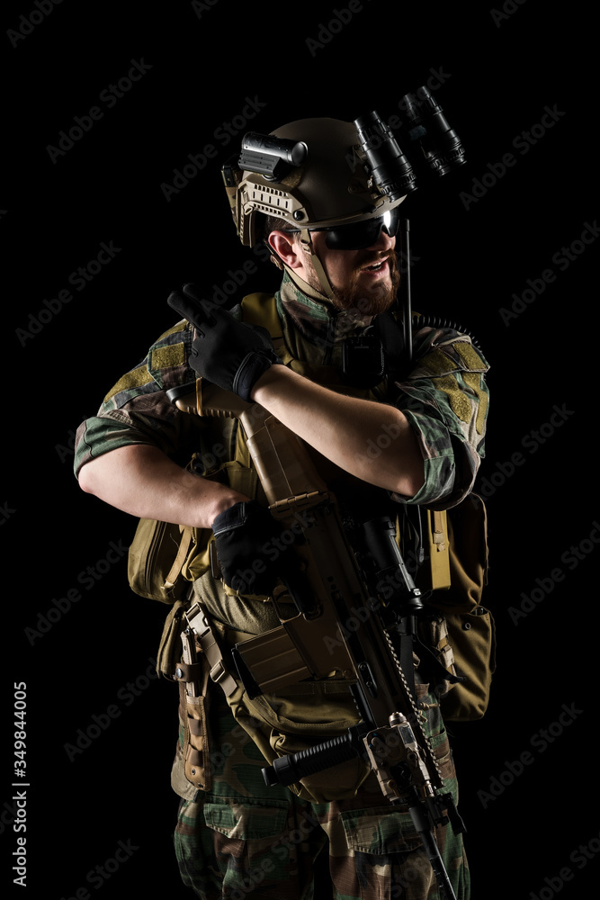 US marine corps soldier with weapon. Shot in studio. isolated with clipping on black background. US marine corps soldier with weapon. Shot in studio. isolated with clipping on black background.