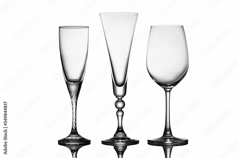 Three elegant stemmed glasses of different shapes