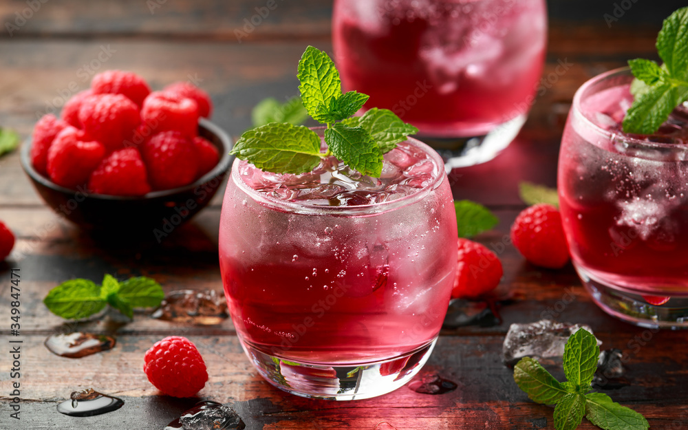 Refreshing Strawberry cocktail with ice and mint on wooden table Refreshing Strawberry cocktail with ice and mint on wooden table