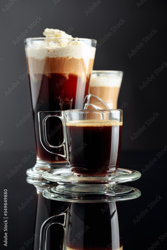 Espresso, latte macchiato and Irish coffee on black background. Espresso, latte macchiato and Irish coffee on black background.