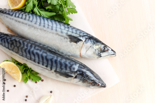 Uncooked Atlantic mackerel with lemon and greens 