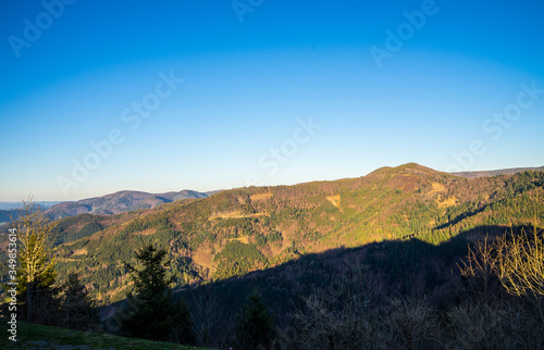 Germany, Impressive forested mountains of nature landscape in black forest scenery with view from hoernleberg mountain with moving shadows