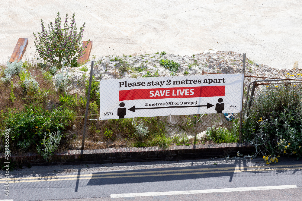 NHS save lives sign on beach