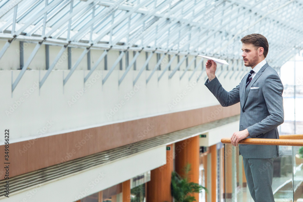 Business man throwing a paper plane Business man throwing a paper plane