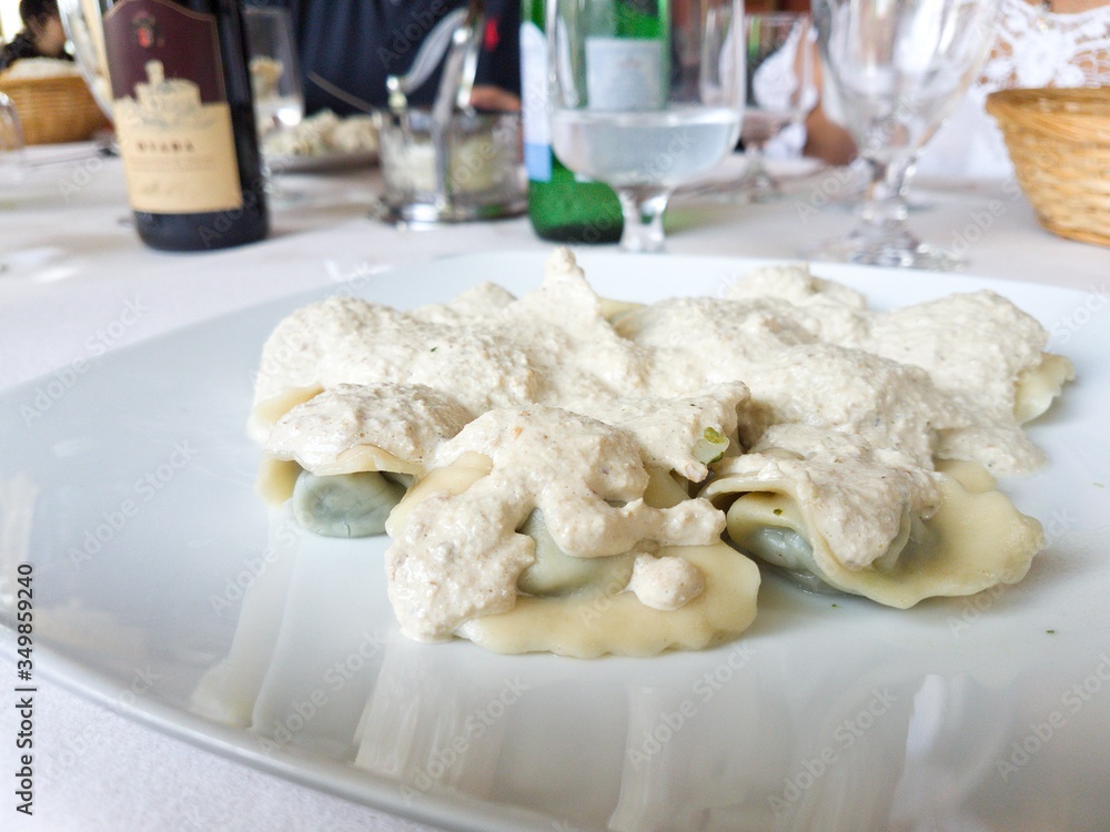 Pansoti con salsa di noce sauce nut a tipical ligurian dish from the regional italian cuisine Pansoti con salsa di noce sauce nut a tipical ligurian dish from the regional italian cuisine