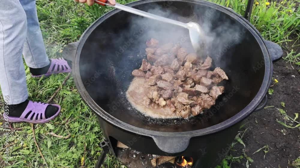 The meat is fried in a cauldron at the stake. The meat is fried in a cauldron at the stake.