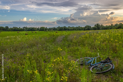 summer landscape with bike and reap