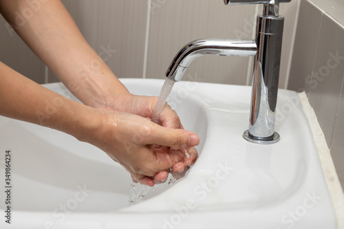Coronavirus pandemic prevention by wash hands and fingers with soap for frequently, using hand sanitizer gel.