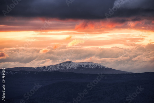 Orange Sun Setting Behind the Mountains © filin174
