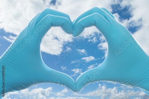 Medical heart against sky clouds background