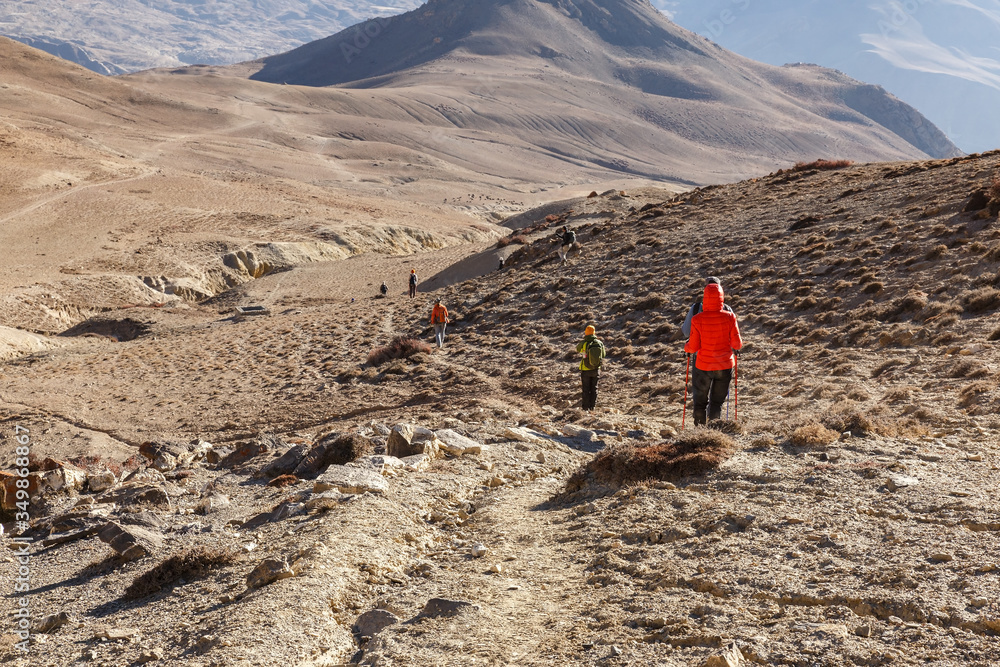 Tourists hiking in the mountains. Himalayas, Nepal. Tourists hiking in the mountains. Himalayas, Nepal.