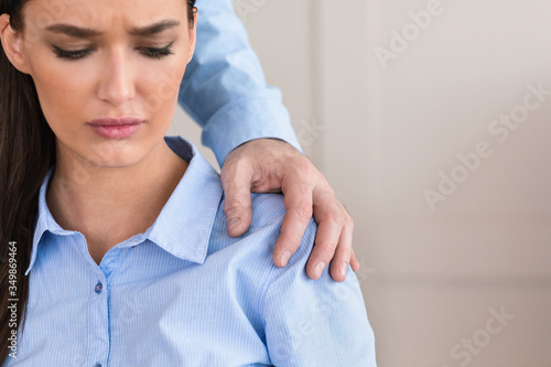 Fotografie Businesswoman Victim Of Sexual Harassment Sitting In Office, Cropped