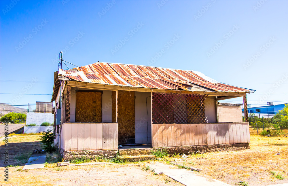 Old Corner One Level Home With Boarded Up Windows & Door Old Corner One Level Home With Boarded Up Windows & Door