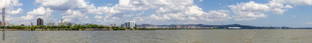 Panorama of Guaiba shore with trees and buildings