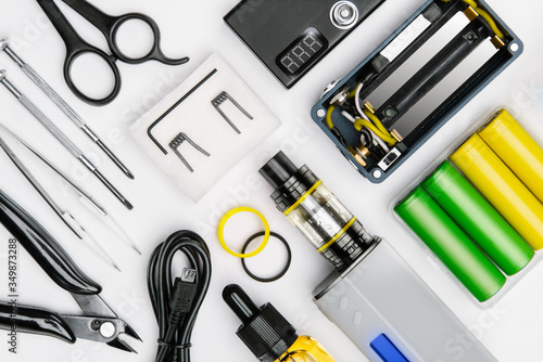 Bilde på lerret tool kit for maintenance and assembly of modern vaping device mod on white background
