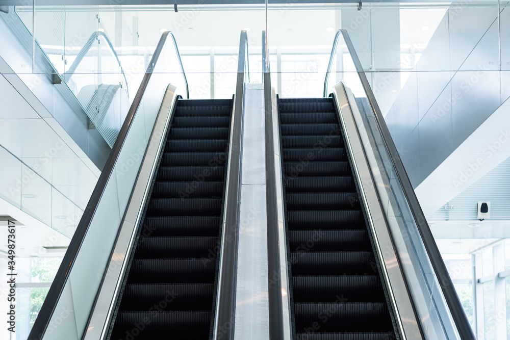 two escalators in the mall and business area, bright background two escalators in the mall and business area, bright background