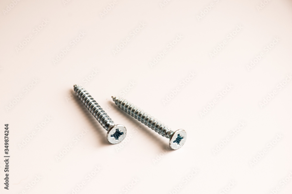 new screws on a white background new screws on a white background