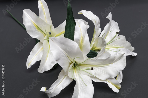 decoration artificial lily on dark grey background