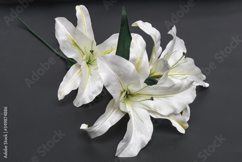 decoration artificial lily on dark grey background