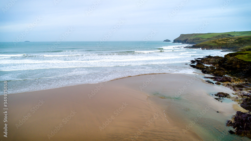 Beach scene, waves and sand, Polzeath, Pentire point, UK