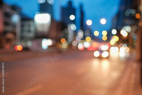 Blurred defocused lights of heavy traffic and abstract blur image of night light bokeh on street - Copy space of transportation and travel concept