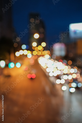 Blurred defocused lights of heavy traffic and blurred traffic road with colorful bokeh lights