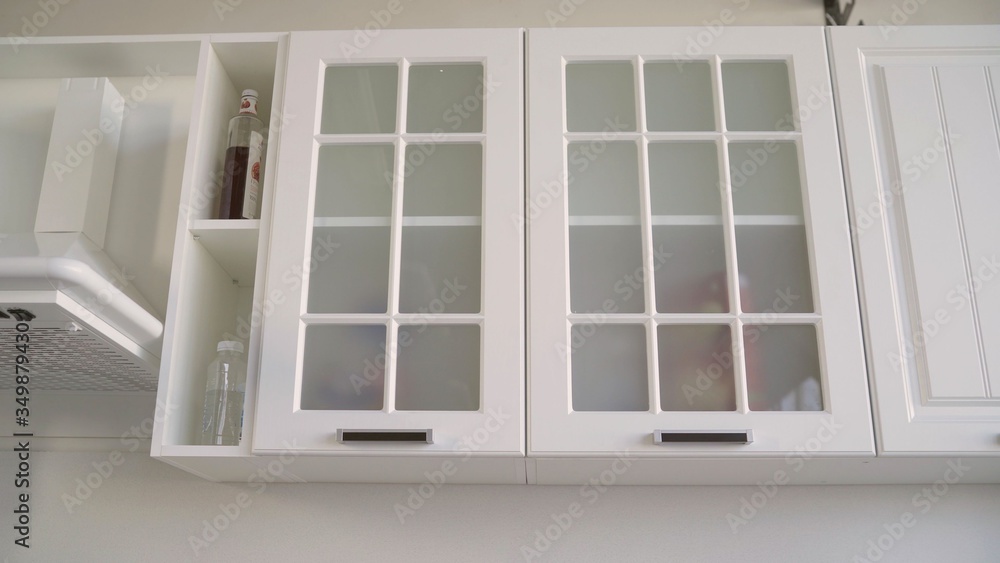 Cupboard part of a white kitchen set. Kitchen white kit. In the West, modern residential kitchen. White cupboard in the kitchen headset. Cupboard part of a white kitchen set. Kitchen white kit. In the West, modern residential kitchen. White cupboard in the kitchen headset.