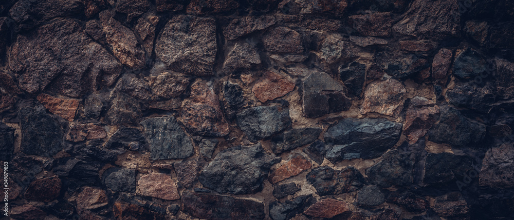 Dark brown stone wall texture background